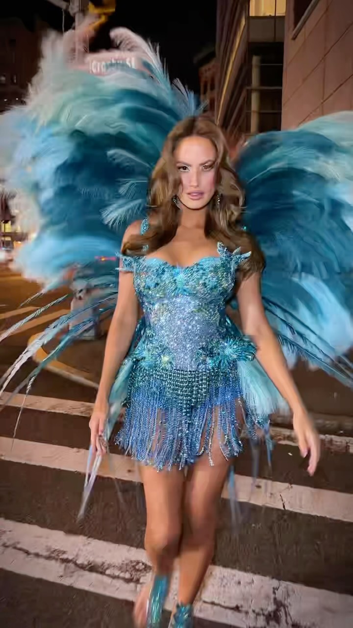 Redhead chaos hits the runway with vegan angel wings and couture confidence